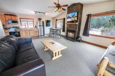a living room with a couch and a coffee table at Rocky Mountain Retreat 1B by Rocky Mountain Resorts in Estes Park