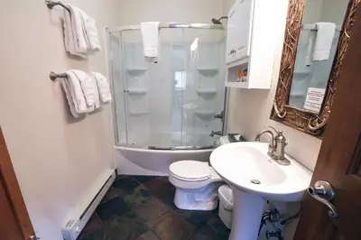 a bathroom with a shower and a toilet and a sink at Rocky Mountain Retreat 1B by Rocky Mountain Resorts in Estes Park