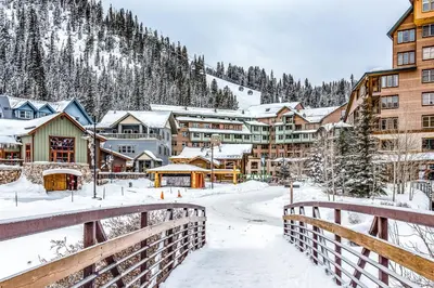 a town in the snow with a bridge at Fraser Crossing 3404 in Winter Park
