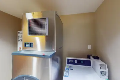a kitchen with a refrigerator and a microwave at Fraser Crossing 3404 in Winter Park