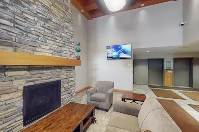 a living room with a couch and a fireplace at Fraser Crossing 3404 in Winter Park