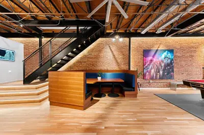 a loft office with a staircase and a desk at Hotel Residential of Denver in Denver