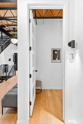 an open door into a room with a couch at Hotel Residential of Denver in Denver