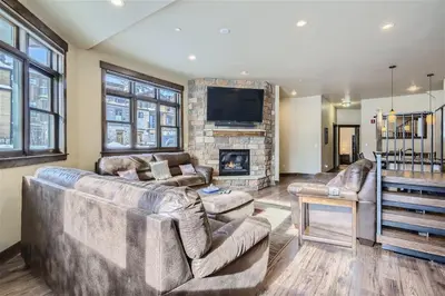 a living room with a couch and a fireplace at Condos Off Main 15 condo in Frisco