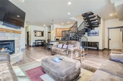 a living room with a couch and a fireplace at Condos Off Main 15 condo in Frisco