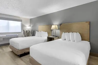 a hotel room with two beds and a window at Best Western Alpenglo Lodge in Winter Park
