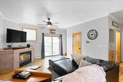 a living room with a couch and a fireplace at Summit Sanctuary in Silverthorne