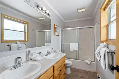 a bathroom with a sink and a toilet and a shower at Summit Sanctuary in Silverthorne