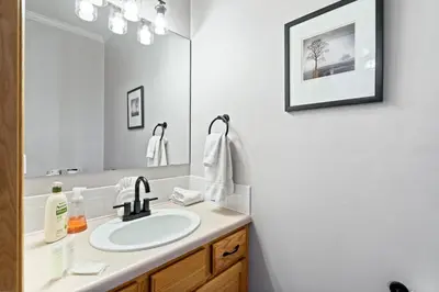 a bathroom with a sink and a mirror at Summit Sanctuary in Silverthorne