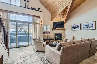 a living room with a couch and a fireplace at Drake Landing #A8 condo in Frisco