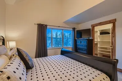 a bedroom with a bed and a window at Drake Landing #A8 condo in Frisco