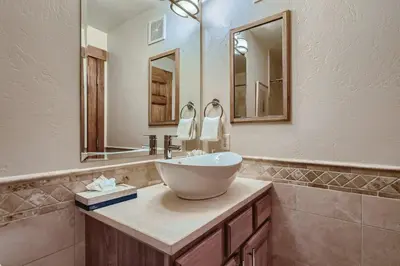 a bathroom with a bowl sink and a mirror at Drake Landing #A8 condo in Frisco