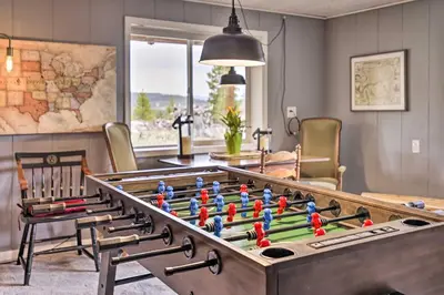 a living room with a large foosball table at 4 Mi to Rocky Moutain Natl Park Grand Lake Home! in Grand Lake