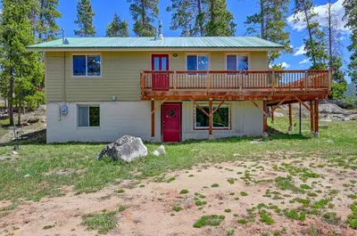 a house with a large deck on top of it at 4 Mi to Rocky Moutain Natl Park Grand Lake Home! in Grand Lake