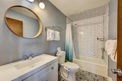 a bathroom with a sink and a toilet and a mirror at 4 Mi to Rocky Moutain Natl Park Grand Lake Home! in Grand Lake