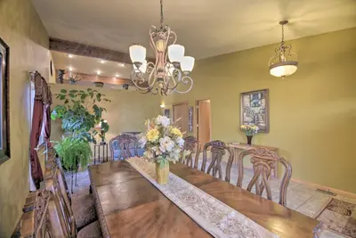 a dining room with a long table and chairs at Charming Home with Yard about 12 Mi to Fort Collins in Loveland