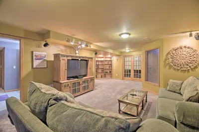 a living room with two couches and a tv at Charming Home with Yard about 12 Mi to Fort Collins in Loveland