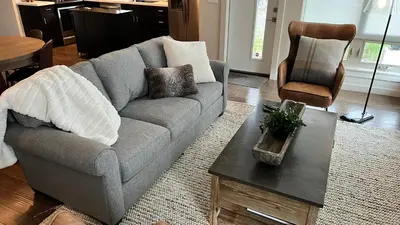 a living room with a couch and a coffee table at 3BD/3BA- Updated Cozy Ski Retreat with Garage at the Base of Granby Ranch in Granby