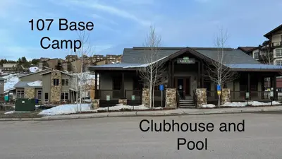 a house on the corner of a street with the words base camp clubhouse at 3BD/3BA- Updated Cozy Ski Retreat with Garage at the Base of Granby Ranch in Granby