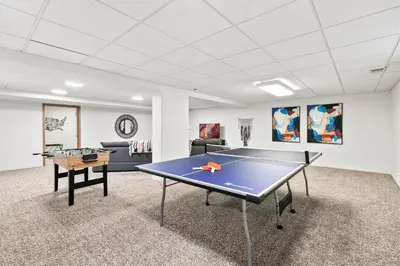 a ping pong room with a ping pong table at Scandinavian Chic - Hot Tub, Bikes and Lake Life! in Loveland