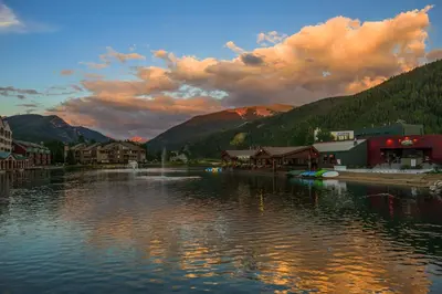 a lake with a town and buildings and mountains at One-Bedroom Apartment in Dillon