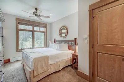 a bedroom with a bed and a window at Luxurious 2 BR in River Run Village with Ski in ski out, Kids Ski Free condo in Dillon