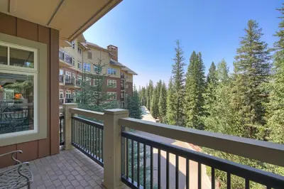 a balcony of a condo with a view of trees at Luxury 3 BR in River Run Village Featuring Ski in, ski out! condo in Dillon
