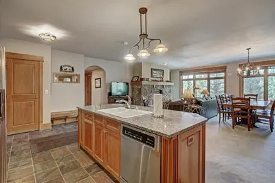 a kitchen with a sink and a counter top at Luxury 3 BR in River Run Village Featuring Ski in, ski out! condo in Dillon