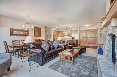 a living room with a couch and a fireplace at Luxury 3 BR in River Run Village Featuring Ski in, ski out! condo in Dillon
