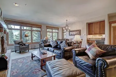 a living room with couches and a table at Luxury 3 BR in River Run Village Featuring Ski in, ski out! condo in Dillon