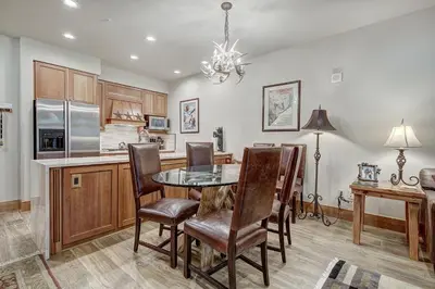 a kitchen and dining room with a table and chairs at One-Bedroom Apartment in Dillon