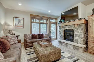 a living room with a couch and a fireplace at One-Bedroom Apartment in Dillon