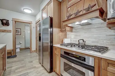 a kitchen with a stove and a refrigerator at One-Bedroom Apartment in Dillon