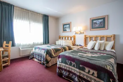 a hotel room with two beds and a window at North Park Inn & Suites in Walden