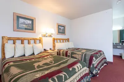 a hotel room with two beds in a room at North Park Inn & Suites in Walden