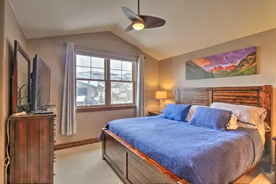 a bedroom with a bed and a tv and a window at 5 Mi to Breckenridge Skiing Mtn Gem with Hot Tub! in Breckenridge