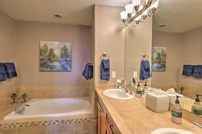 a bathroom with two sinks and a bath tub at 5 Mi to Breckenridge Skiing Mtn Gem with Hot Tub! in Breckenridge