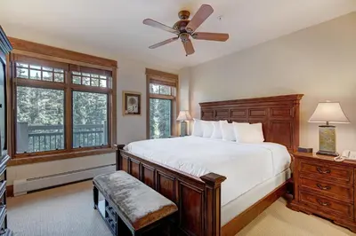 a bedroom with a bed and a ceiling fan at Luxurious 1 BR in River Run Village with Ski in ski out condo in Dillon