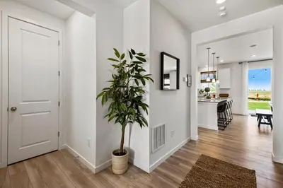 a hallway of a home with a potted plant at Spacious Home, Great Backyard with Mtn Sunset Views! in Loveland