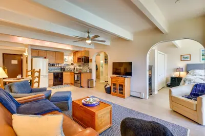 a living room with a couch and a table at Mtn and Reservoir Views Cozy Dillon Condo! in Dillon