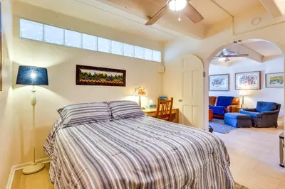 a bedroom with a bed and a large window at Mtn and Reservoir Views Cozy Dillon Condo! in Dillon