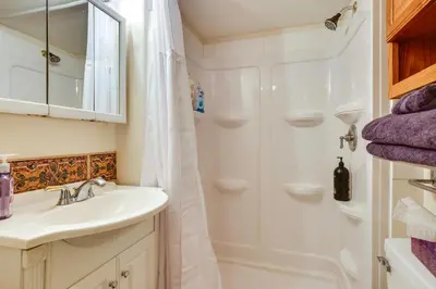 a bathroom with a sink and a shower at Mtn and Reservoir Views Cozy Dillon Condo! in Dillon