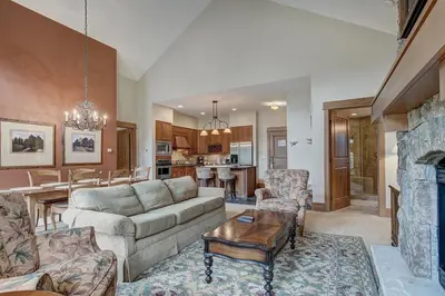 a living room with a couch and a fireplace at Luxurious 2 BR in River Run Village with Ski in ski out condo in Dillon