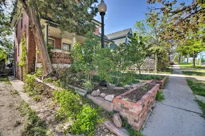 a garden in front of a house at Fresh Downtown Longmont Apartment - Walk to Main! in Longmont