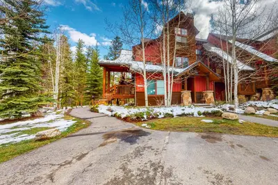 a large red house with a driveway in front of it at Seasons 1840 in Keystone
