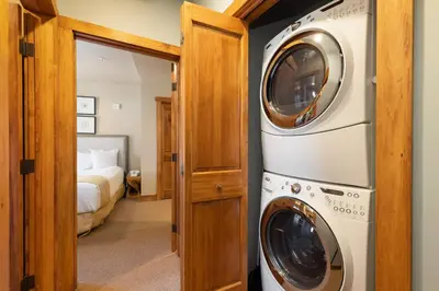 a bathroom with a washer and dryer in a room at 2300 Red Hawk Lodge condo in Keystone