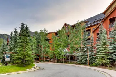 a large building with a road in front of it at Beautiful 1 Bedroom Mountain Condo In River Run Village With Hot Tub Access And Walking Distance To The Gondola in Keystone