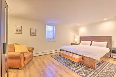 a bedroom with a bed and a couch and a chair at Frisco Mountain Hub Walk to Main Street in Frisco