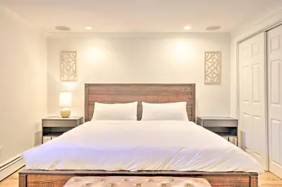 a bedroom with a large white bed with two tables at Frisco Mountain Hub Walk to Main Street in Frisco