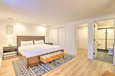 a bedroom with a large bed and a bathroom at Frisco Mountain Hub Walk to Main Street in Frisco